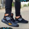 Trebol_Negro_Naranja Imagen modelo calzado deportivo