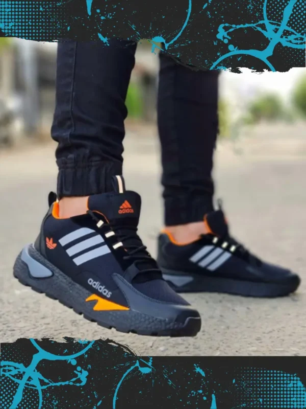 Trebol_Negro_Naranja Imagen modelo calzado deportivo